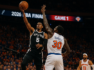alt_text: Thrilling NBA Finals matchup: Spurs vs. Knicks, showcasing intense gameplay and passionate fans.